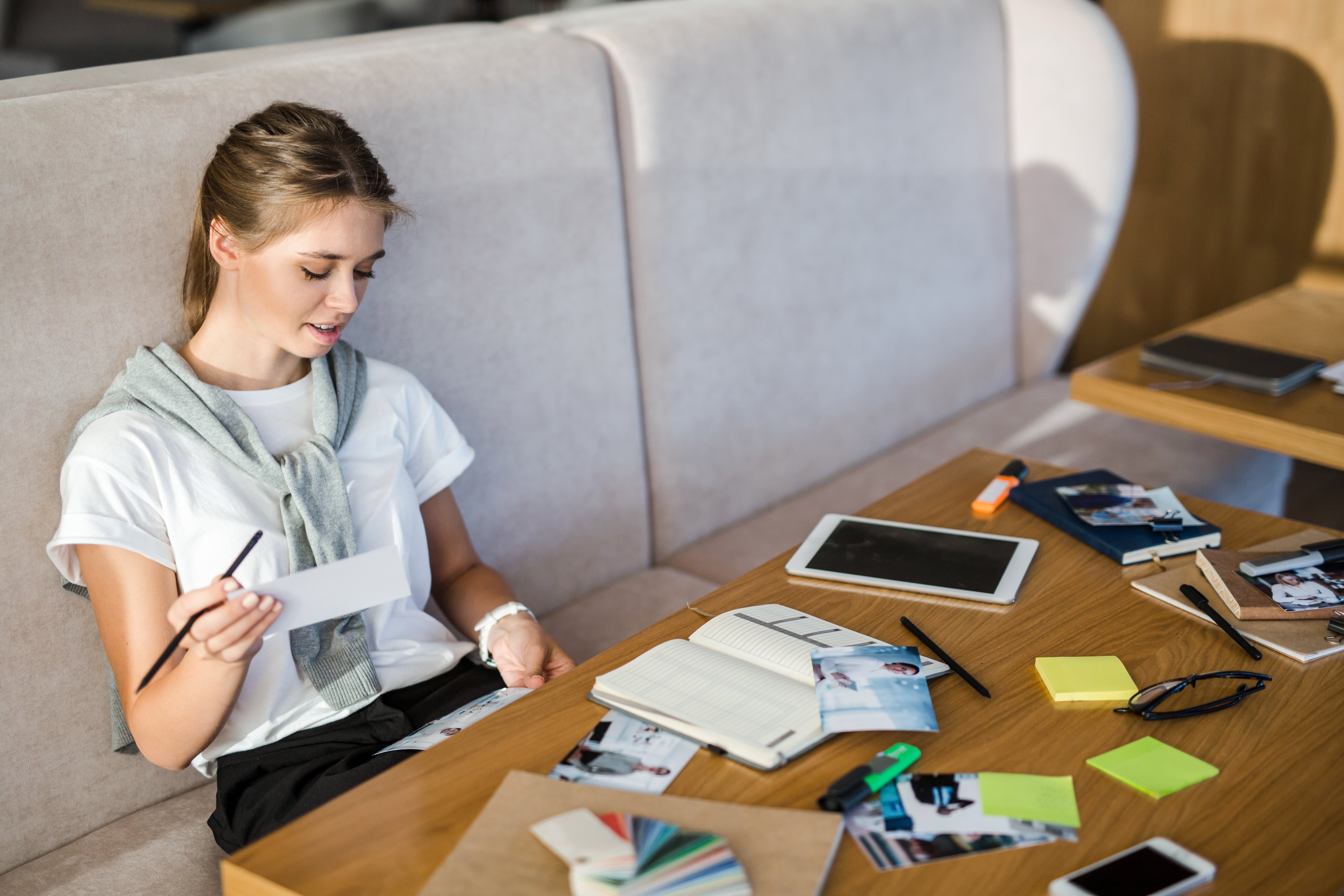 Woman organizes notes for project