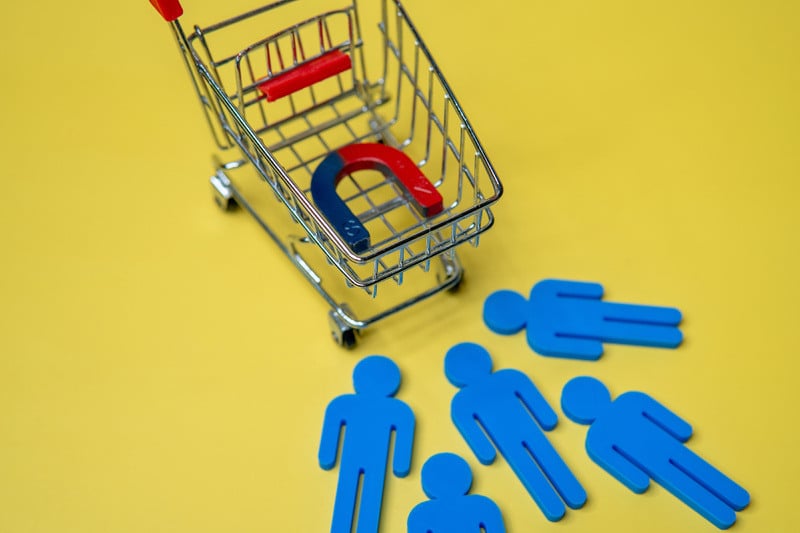 Graphic of magnet inside a shopping cart as it pulls people closer 